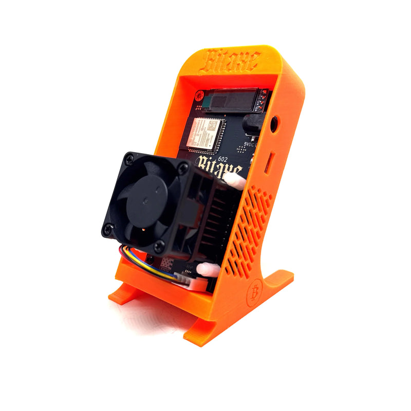 The Bitaxe Solo Bitcoin Miner, an ultra-compact, open-source home ASIC crypto mining device featuring an exposed circuit board, active cooling fan, and a built-in digital display for real-time hashrate monitoring.